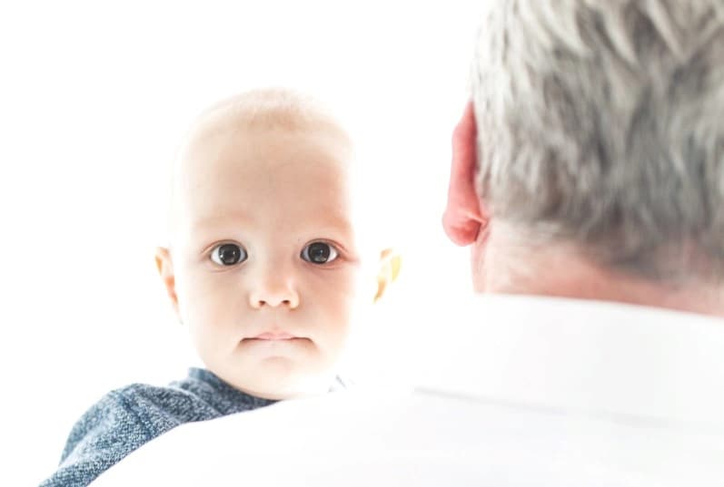 A diverse group of people of different ages and backgrounds engaging in various activities together in a vibrant and inclusive community