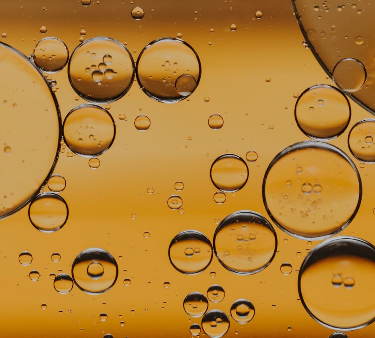 Beer with oil bubbles, a modern twist on a classic drink, showcasing the latest trend in beverage presentation.